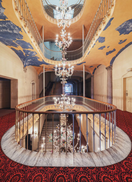 An abandoned hotel with a Murano chandelier