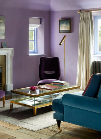 Finished living room interior design to promote a sustainable interior design, the original fireplace was renovated using one from Jamb. A glass and metal coffee table is central the living room decoration, and was supplied by Ed Butcher Antiques.
