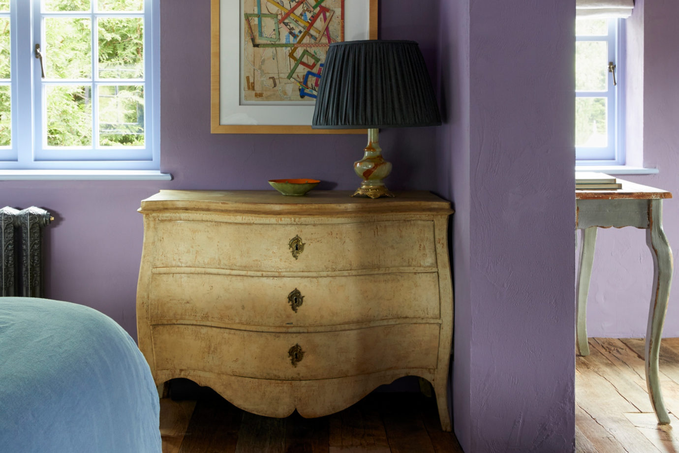 An antique chest of drawers from Augustus Brandt is perfectly imperfect in a Grade II listed bedroom interior design by Surrey interior designer Ana Engelhorn.