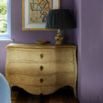An antique chest of drawers from Augustus Brandt is perfectly imperfect in a Grade II listed bedroom interior design by Surrey interior designer Ana Engelhorn.