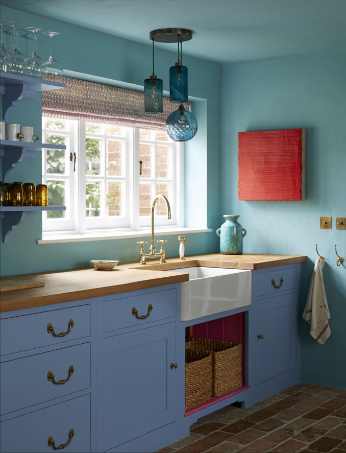 A traditional Bedford sink supplied by Plain English in old-fashioned wooden kitchen drawers. Both of which are amazing interior design ideas for kitchen in a country home.
