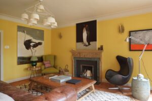 Beautiful lounge area of a Surrey home renovation with yellow painted walls designed by Ana Engelhorn